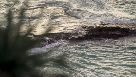 Slowmotion-clip-rocky-coast-with-waves-splashing-against-the-rocks-in-the-atlantic-ocean