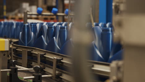 A-factory-line-moving-blue-oil-jugs