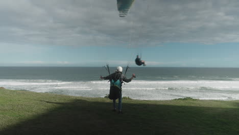 Paraglider-prepping-his-kite-and-taking-off
