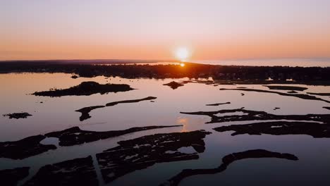 Aerial-sunset-shot-of-Rhode-Island-marsh-land