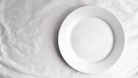 Dried-Porcini-mushroom-on-white-ceramic-tableware-on-white-table-mat