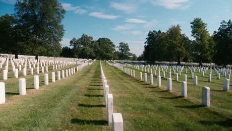 Arlington-Cemetery-Grave-yard-grass-trees-nature-historic-Sky-Clouds-sliding-shot-4k