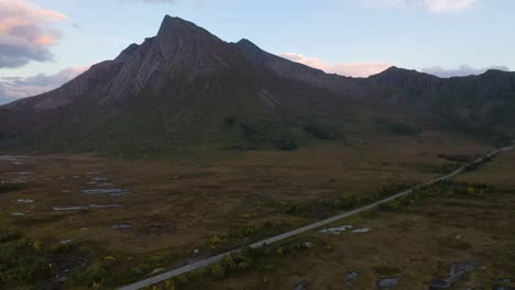 Sharp-Peak-of-a-Mountain-and-Road-through-Swamp-in-Northern-Norway
