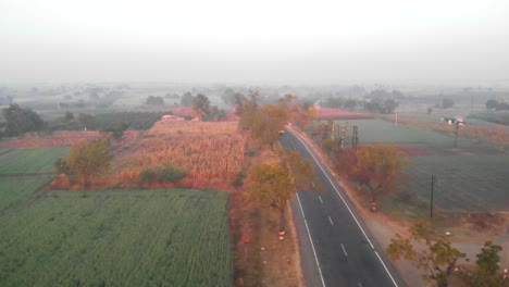 highway-in-running-through-village-crops-and-farms