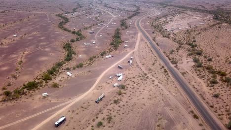 Panoramic-Drone-aerial-of-some-dispersed-camping-in-Desert---Quartzsite-AZ