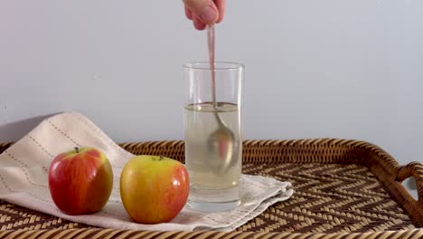 Adding-apple-cider-vinegar-to-glass-of-water-for-weight-loss-and-health