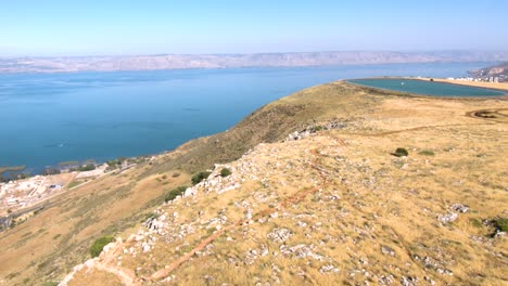 The-beautiful-rocky-Arbel-cliff,-overlooking-the-sea-of-Galilee---low-aerial