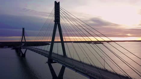 Aerial,-amazing-scenery-in-the-land-of-thousand-lakes,-sunset-at-Replot-bridge-in-Finland