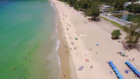 Aerial-view-of-paradise-beach-in-Phuket,-crystal-clear-water,-calm-sea,-white-sand