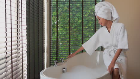Asian-woman-preparing-to-take-a-bath-with-foam,-bubbles