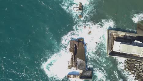 Aerial-view-of-the-waves-destruction-on-the-deactivated-marina-of-Lugar-de-Baixo,-Ponta-do-sol,-Madeira-Ísland,-Portugal