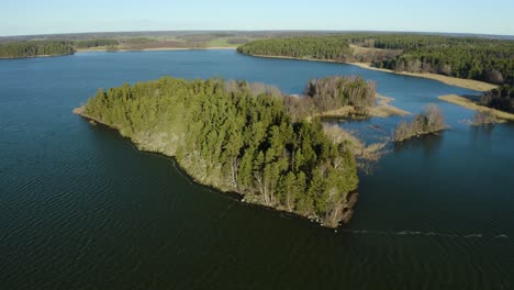 Härjarö-nature-preserve-in-Sweden,-small-forested-islet-on-lake-Mälaren---aerial-view