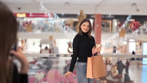 young-girl-is-photographed-with-packages-after-shopping