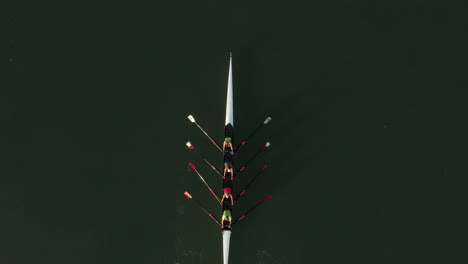 Top-aerial-directly-above-shot-of-rowing-crew-coxless-quadruple-scull