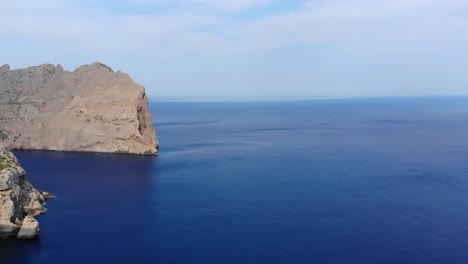 Aerial-Pan-Left-View-Of-Cliffs-Of-Cap-De-Formentor-With-Calm-Blue-Seas