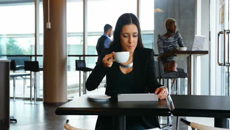 Female-executive-using-digital-tablet
