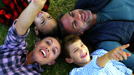 Happy-family-lying-on-the-grass