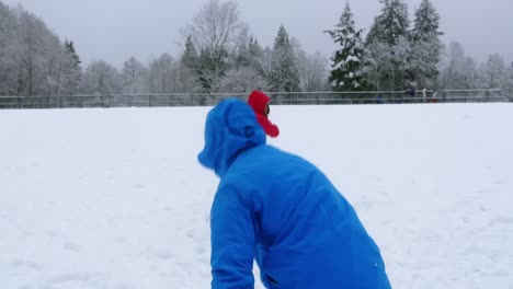 Couple-playing-with-snowball