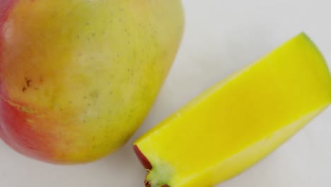 Slices-of-mango-on-white-background