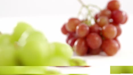 Close-up-of-green-and-red-bunches-of-grapes