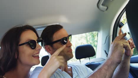 Couple-together-in-a-car-on-road-trip