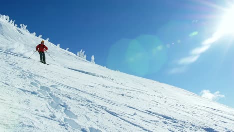 Person-snowboarding-on-snowy-mountain