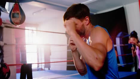Boxers-practicing-in-boxing-ring