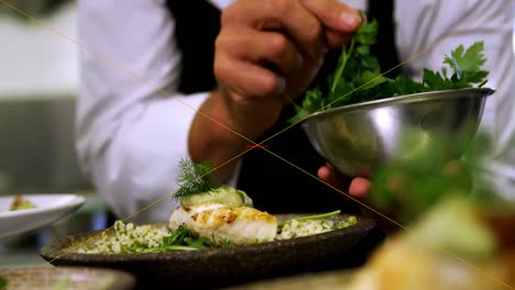 Male-chef-garnishing-appetizer-in-plate