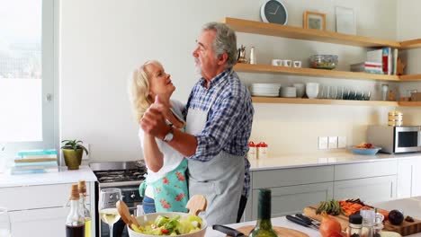 Couple-dancing-in-kitchen