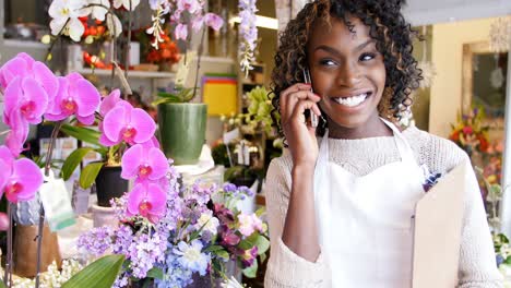 Female-florist-talking-on-mobile-phone-4k