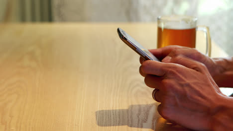 Man-hand-using-mobile-phone-in-restaurant-4k