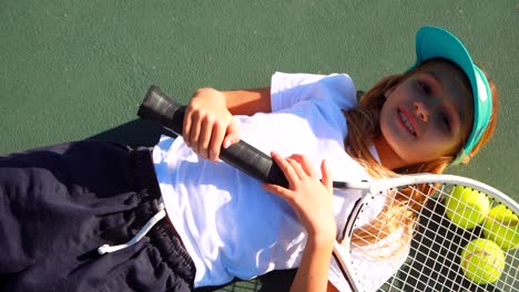 Portrait-of-cute-schoolgirls-relaxing-in-tennis-court-4k