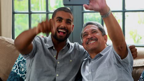 Father-and-son-taking-selfie-with-mobile-phone-4k