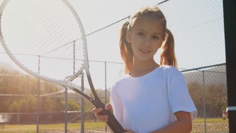 Portrait-of-cute-schoolgirls-standing-with-racket-4k