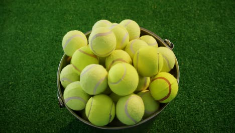 Tennis-balls-in-bucket-at-studio-4k