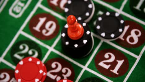 Casino-chips-on-roulette-on-poker-table-4k