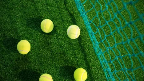 Overhead-view-of-tennis-balls-on-grass-4k