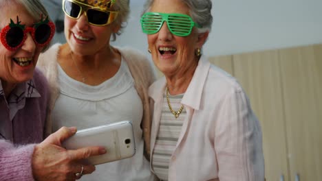 Senior-friends-taking-selfie-with-mobile-phone-4k