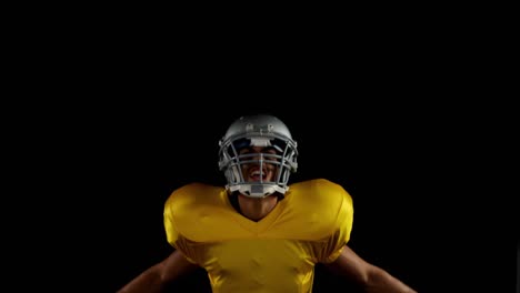 American-football-player-cheering-with-ball-in-his-hand-4k