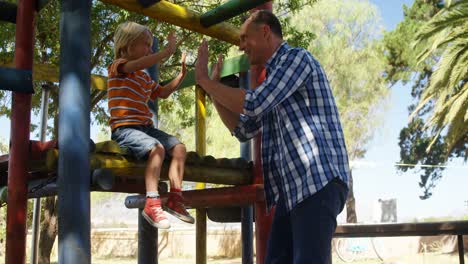 Father-and-son-having-fun-at-playground-4k