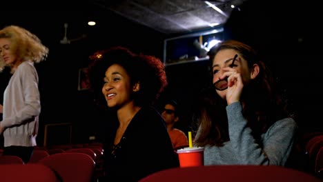 Friends-wearing-3d-glasses-while-watching-movie-4k
