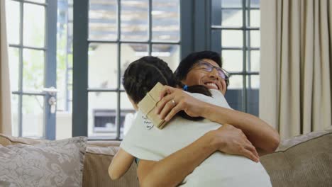 Father-hugging-daughter-in-living-room-4k