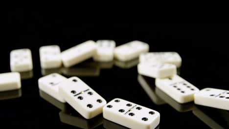 Person-touching-dice-on-black-background-4k