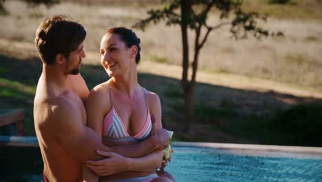 Couple-relaxing-in-pool-during-safari-vacation-4k
