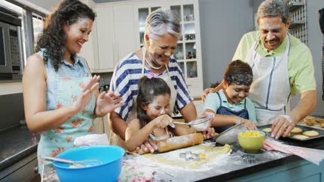 Family-preparing-cookies-in-the-kitchen-4K-4k