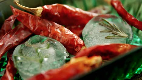 Flavored-ice-cubes-with-herb-and-dried-red-chili-pepper-4k
