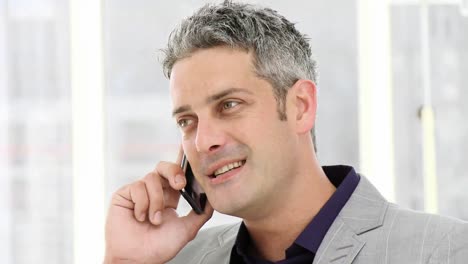 Lucky-businessman-talking-on-phone