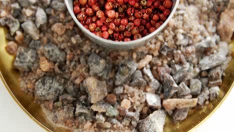 Red-spice-seeds-and-black-salt-in-tray-4k