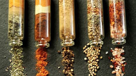Various-spices-spilled-out-of-jar-4k