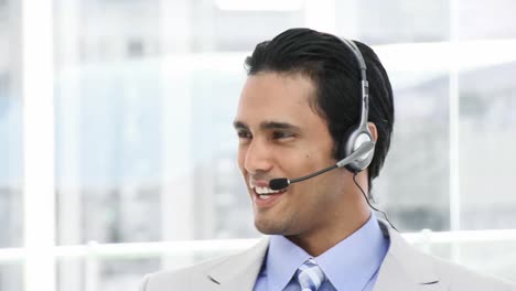 Ethnic-Business-man-using-a-headset
